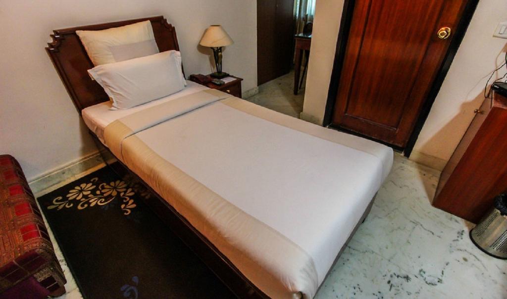 Hotel Pigeon International Bangalore Chambre photo